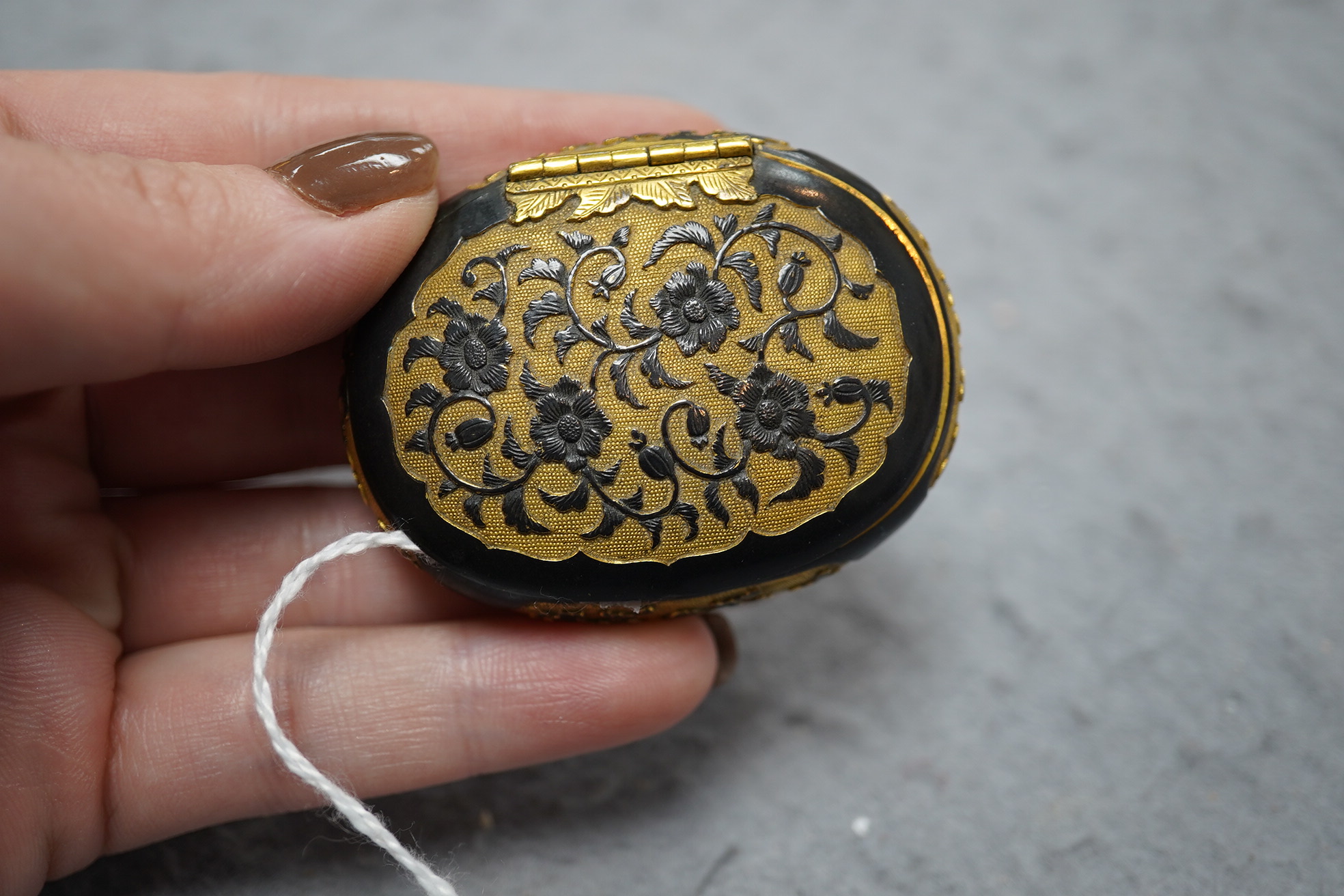 A small Japanese export gilt bronze Sawasa oval tobacco box, 18th century